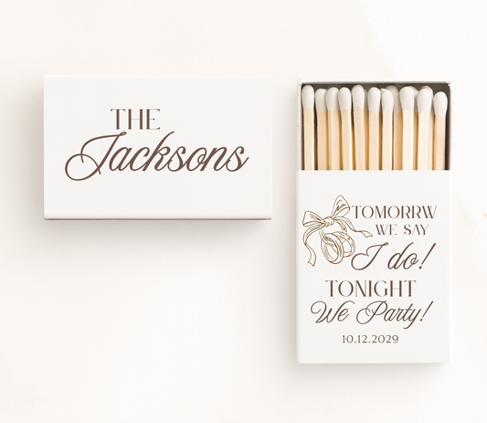Personalized wedding rehearsal matchboxes featuring "Tomorrow We Say I Do, Tonight We Party!" with custom family name and wedding date.